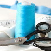 Tailor hemming pants at Joe’s Cleaners in Westbury NY
