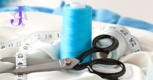 Tailor hemming pants at Joe’s Cleaners in Westbury NY